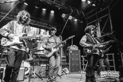 Al Schnier with Dogs in a Pile - Sunshine Hootenanny '24. 📸: Brier Media Photography